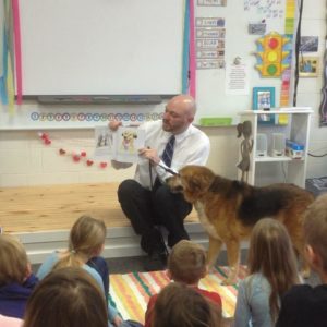 Author Jason Johnson reads his book to a classroom